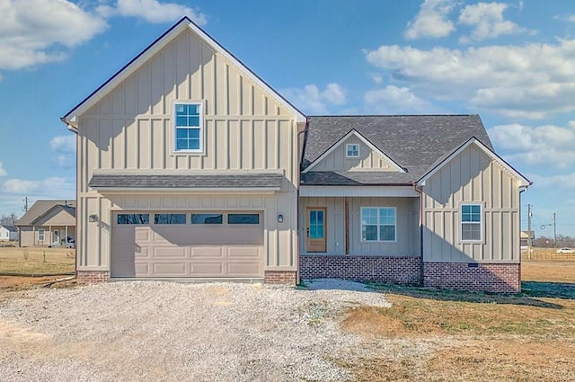 view of front of property with roof with shingles, board and batten siding, and driveway