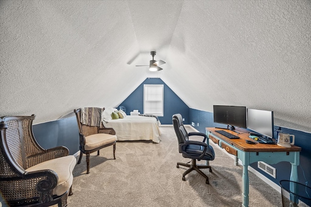 home office with light carpet, baseboards, visible vents, lofted ceiling, and a textured ceiling