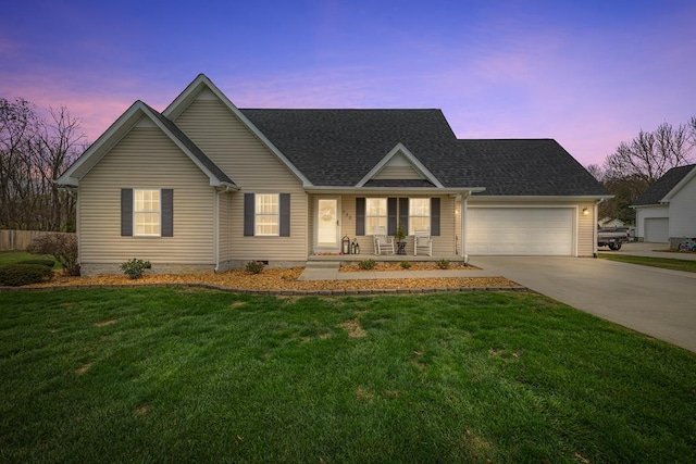 view of front of house featuring roof with shingles, covered porch, an attached garage, driveway, and a front lawn