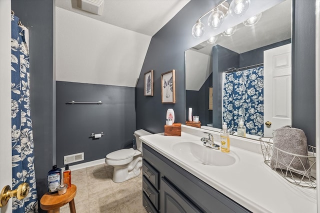 bathroom with baseboards, visible vents, toilet, vaulted ceiling, and vanity