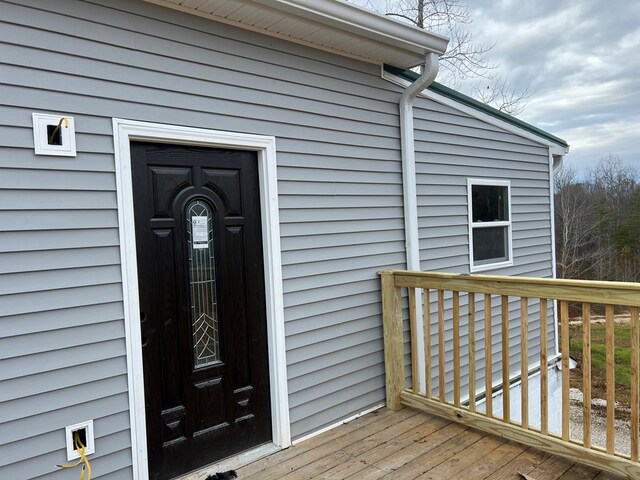 entrance to property featuring a deck