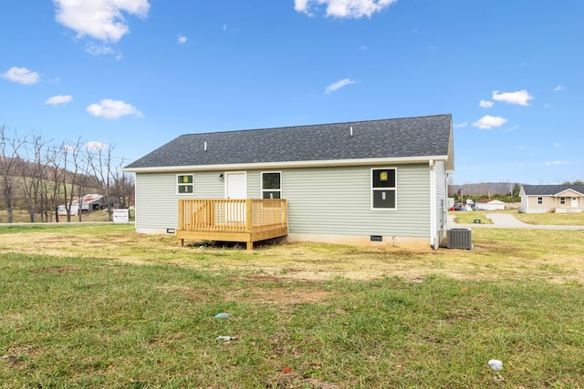 rear view of property featuring cooling unit, crawl space, a lawn, and a wooden deck