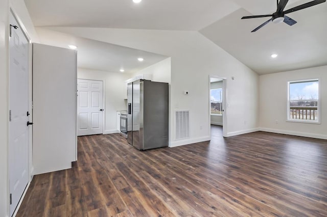 interior space with baseboards, visible vents, a ceiling fan, lofted ceiling, and dark wood-style flooring