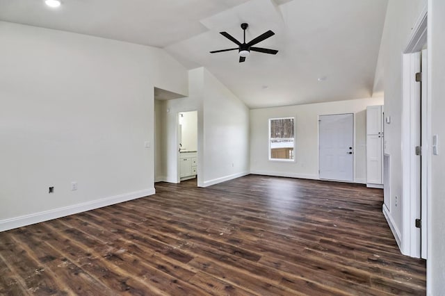 unfurnished living room featuring a ceiling fan, baseboards, vaulted ceiling, and dark wood-style flooring