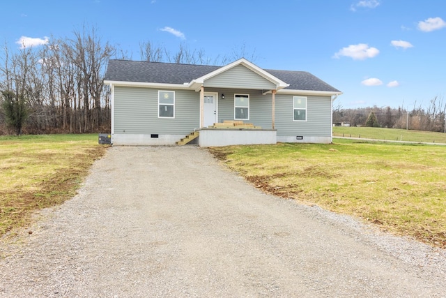 view of front facade featuring driveway, a porch, crawl space, and a front yard