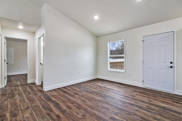 entryway featuring lofted ceiling, dark wood-type flooring, recessed lighting, and baseboards