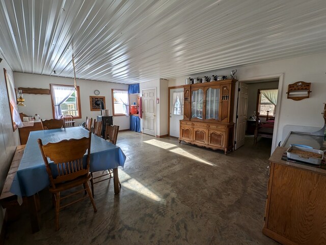 dining area with concrete flooring