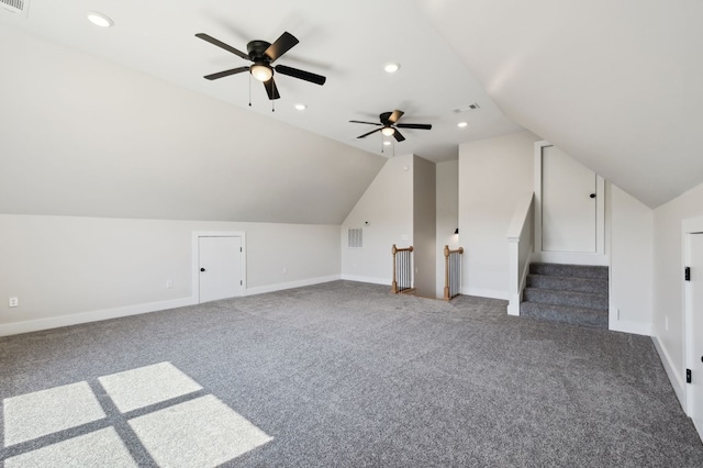 additional living space featuring lofted ceiling, baseboards, visible vents, and ceiling fan