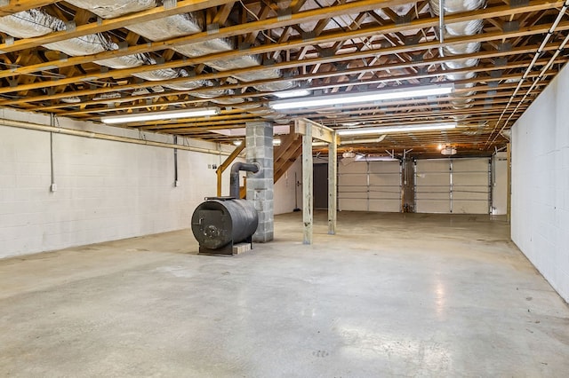 garage with concrete block wall and heating fuel