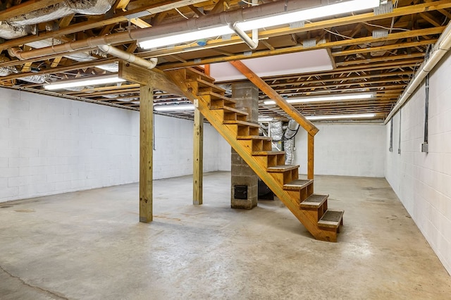 unfinished basement with stairs