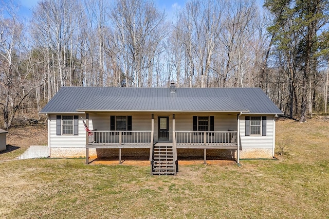 ranch-style house with stairs, metal roof, a front lawn, and a porch