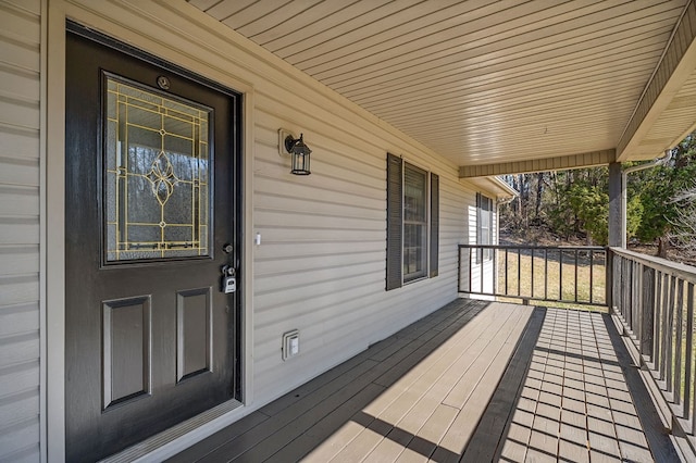 wooden terrace with a porch