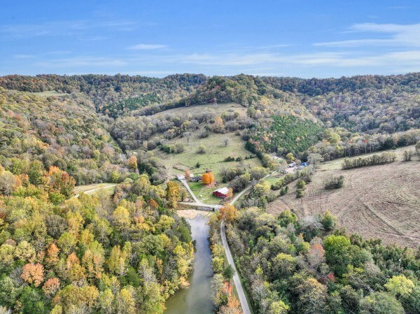 aerial view featuring a wooded view