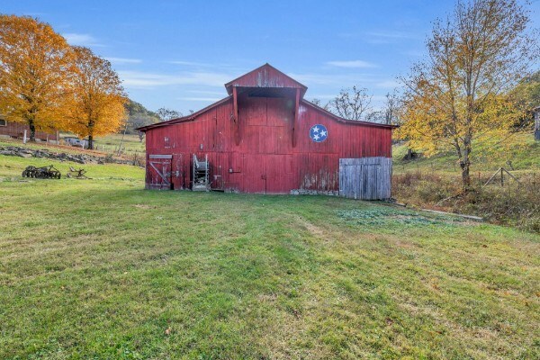 view of barn with a lawn