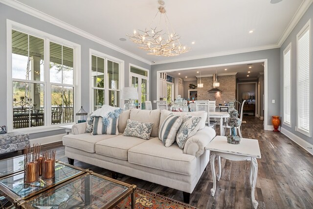 living area with ornamental molding, dark wood-style flooring, a notable chandelier, and baseboards