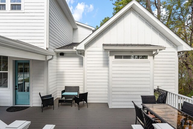 wooden deck with outdoor dining space