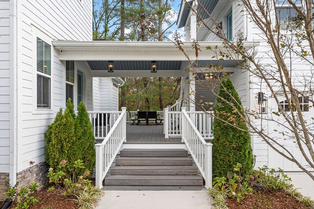 doorway to property featuring a porch