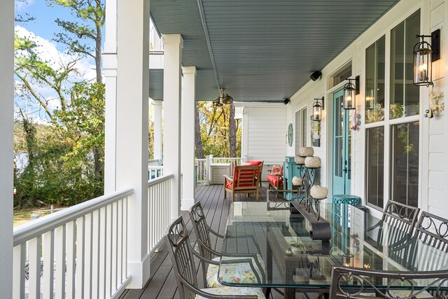 wooden terrace featuring a porch