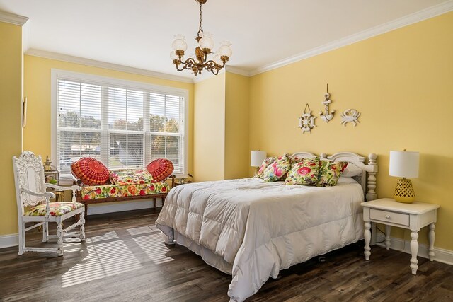 bedroom with ornamental molding, a chandelier, dark wood-type flooring, and baseboards