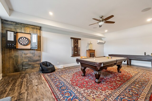 recreation room with billiards, baseboards, wood finished floors, a wall mounted AC, and recessed lighting