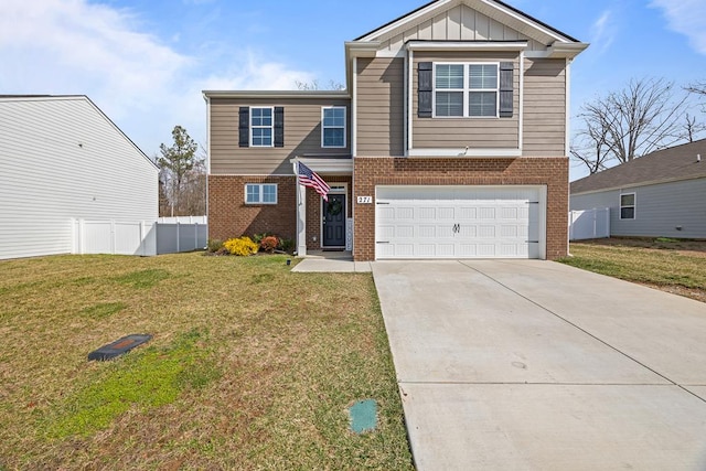 view of front of house with driveway, fence, a front lawn, and board and batten siding