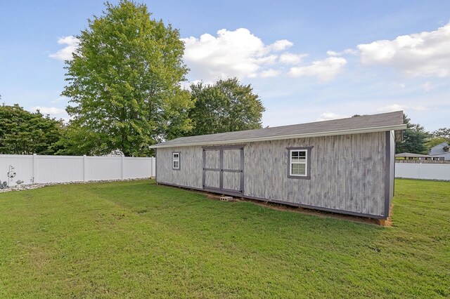 view of shed with fence