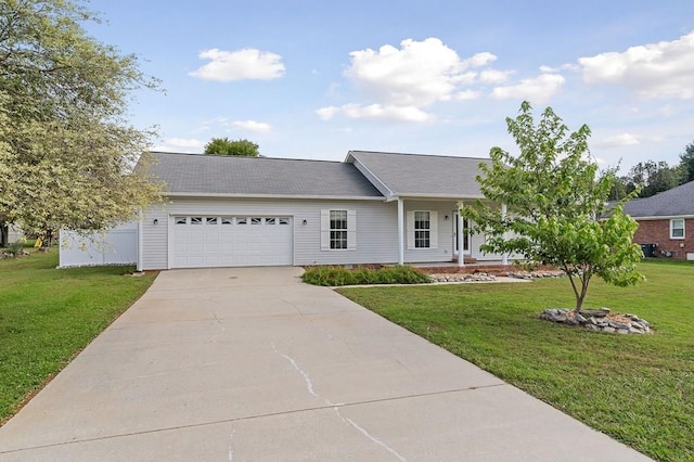 ranch-style house with an attached garage, driveway, a front yard, and fence