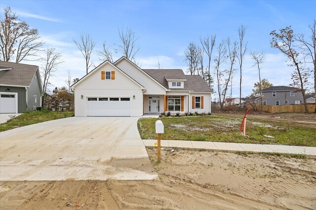 view of front of property featuring a garage and driveway