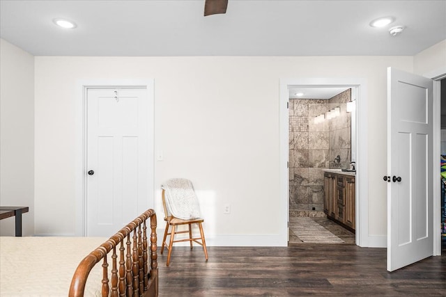 unfurnished bedroom with recessed lighting, dark wood finished floors, and baseboards