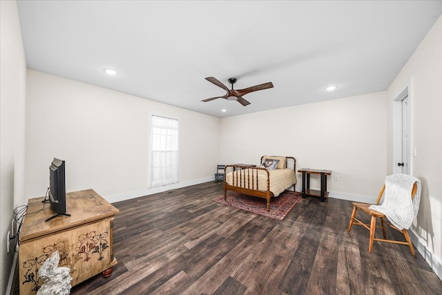 bedroom with recessed lighting, dark wood finished floors, and baseboards