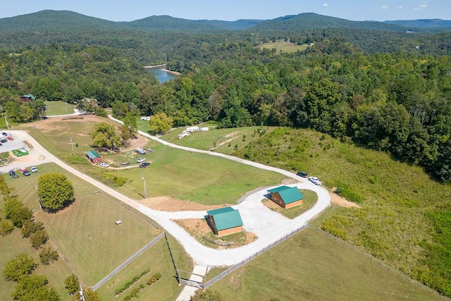 bird's eye view with a forest view and a water and mountain view