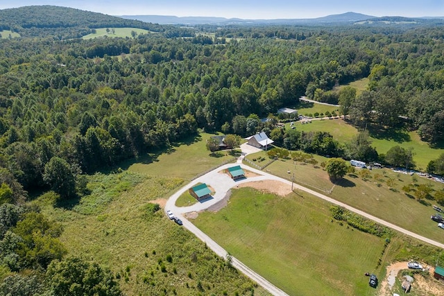 bird's eye view featuring a forest view