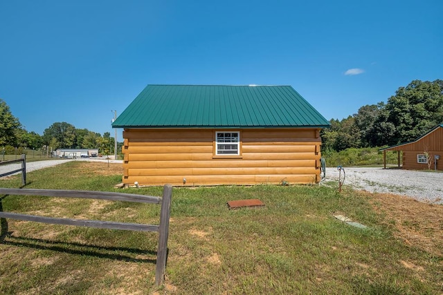 view of outdoor structure featuring fence