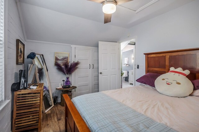 bedroom with lofted ceiling, dark wood finished floors, and a ceiling fan