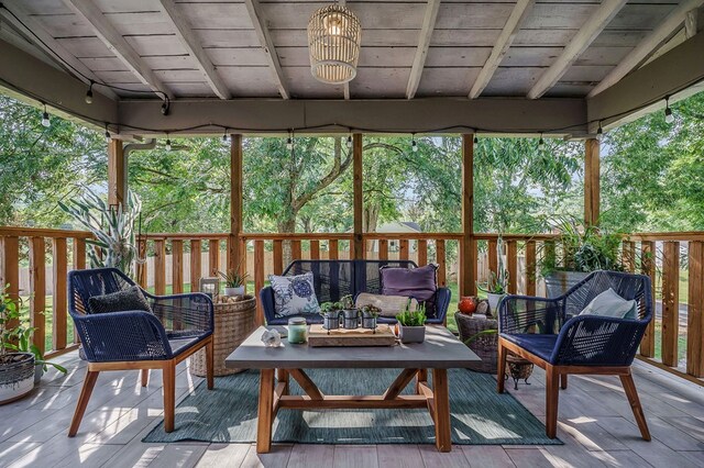 sunroom with wooden ceiling and beam ceiling