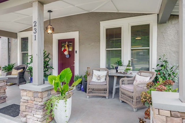 property entrance featuring stucco siding