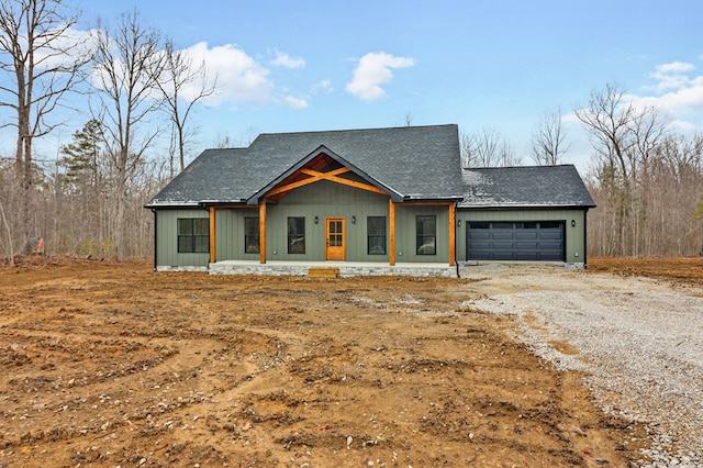 view of front of property featuring a garage and driveway