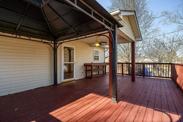 deck with a ceiling fan and a gazebo