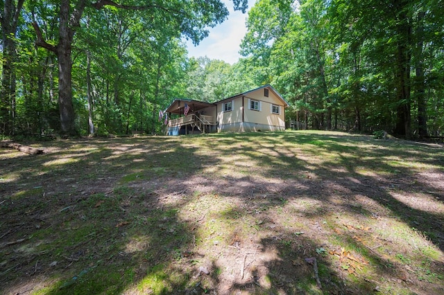 view of yard with a forest view