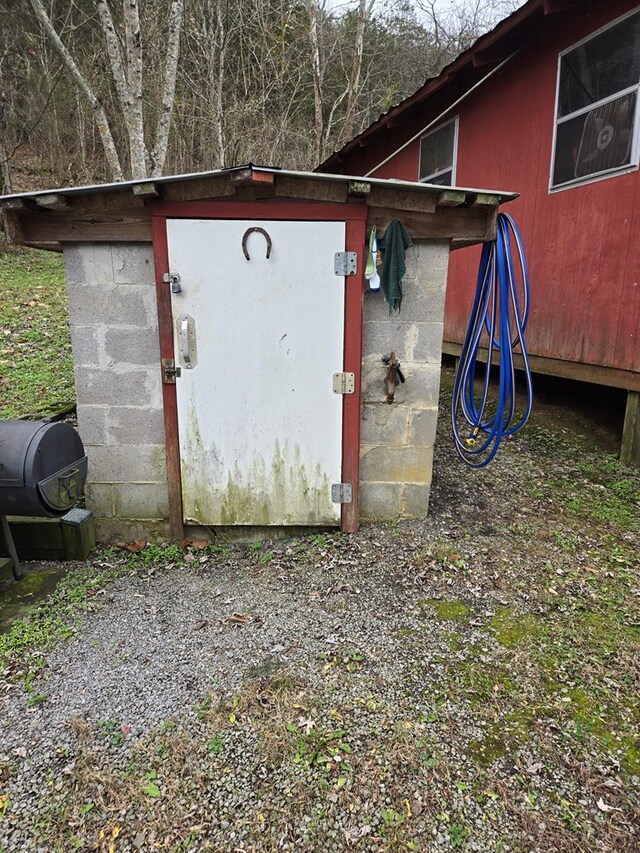 view of storm shelter with an outdoor structure