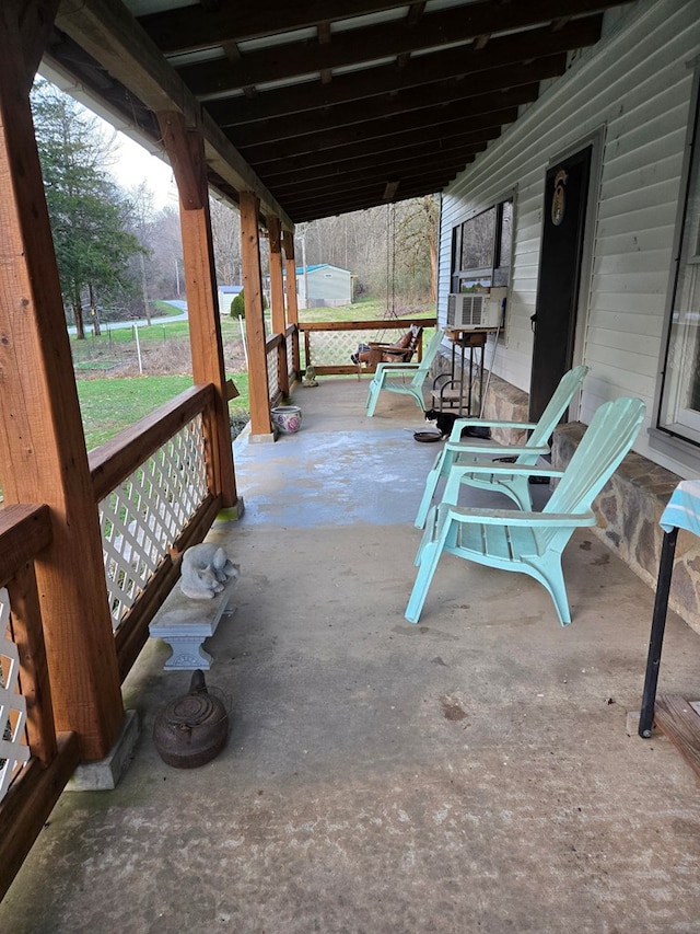 view of patio / terrace featuring covered porch and cooling unit