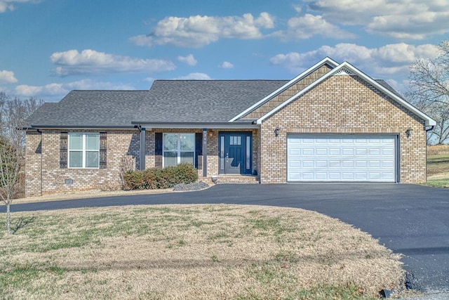 view of front facade featuring an attached garage, a shingled roof, brick siding, driveway, and crawl space