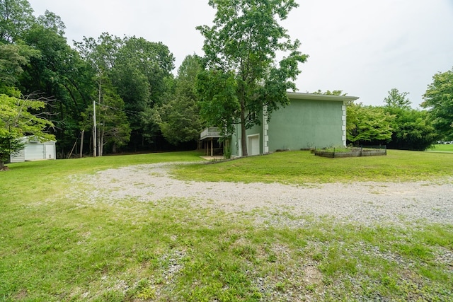 view of yard featuring a garage