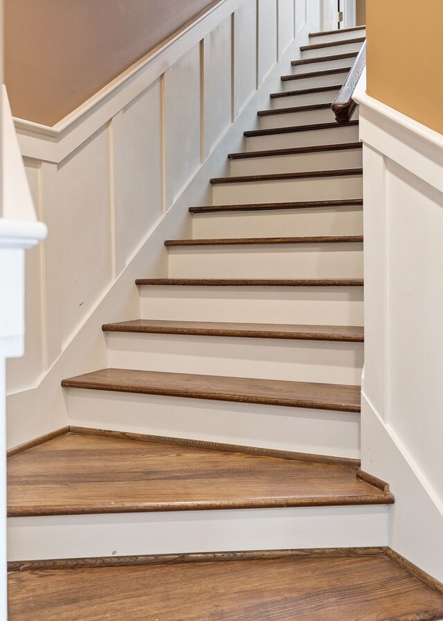 staircase with wood finished floors