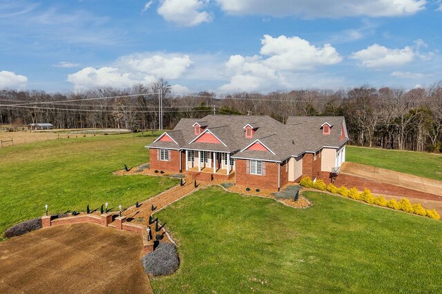 view of front of property featuring crawl space, covered porch, and a front lawn