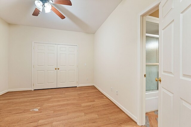 unfurnished bedroom featuring light wood finished floors, baseboards, and a closet