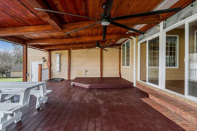 wooden deck featuring a ceiling fan