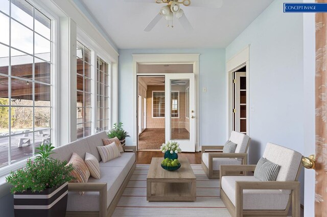 sunroom / solarium featuring a ceiling fan