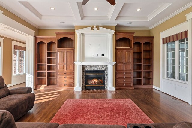 living area with dark wood-style floors, coffered ceiling, and a fireplace