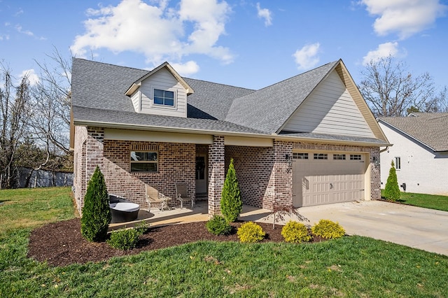 view of front facade featuring a garage, driveway, brick siding, and a front lawn